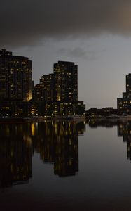 Preview wallpaper city, buildings, reflection, water, twilight