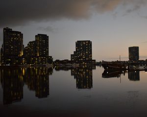 Preview wallpaper city, buildings, reflection, water, twilight
