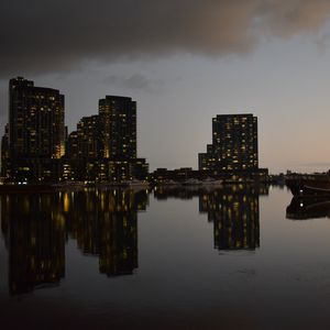 Preview wallpaper city, buildings, reflection, water, twilight
