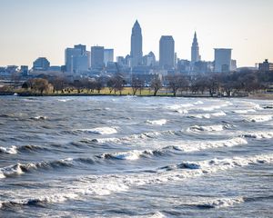 Preview wallpaper city, buildings, river, water, waves, trees