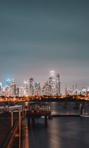 Preview wallpaper city, buildings, river, pier, twilight