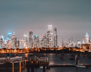 Preview wallpaper city, buildings, river, pier, twilight