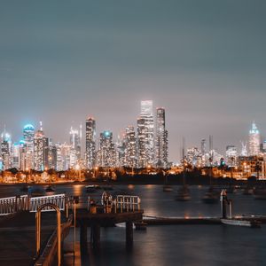 Preview wallpaper city, buildings, river, pier, twilight