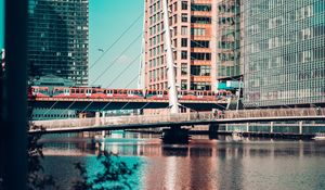 Preview wallpaper city, buildings, river, train, bridge
