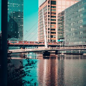 Preview wallpaper city, buildings, river, train, bridge