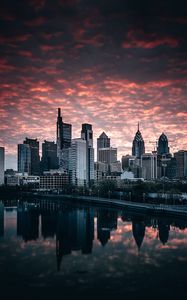 Preview wallpaper city, buildings, river, shore, reflection