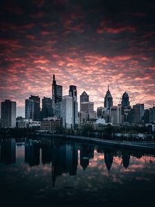 Preview wallpaper city, buildings, river, shore, reflection