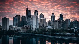 Preview wallpaper city, buildings, river, shore, reflection