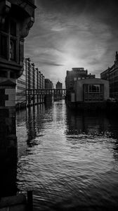 Preview wallpaper city, buildings, river, water, black and white