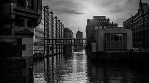 Preview wallpaper city, buildings, river, water, black and white