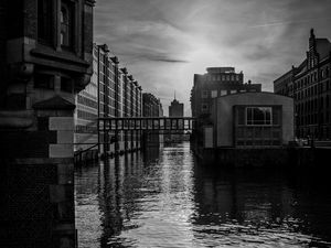 Preview wallpaper city, buildings, river, water, black and white