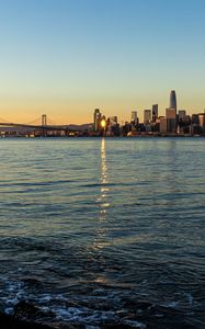 Preview wallpaper city, buildings, river, water, light, twilight