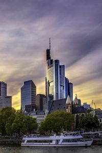 Preview wallpaper city, buildings, river, boat, embankment