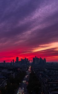 Preview wallpaper city, buildings, road, lights, sunset, evening