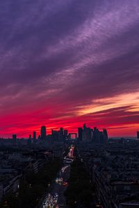 Preview wallpaper city, buildings, road, lights, sunset, evening