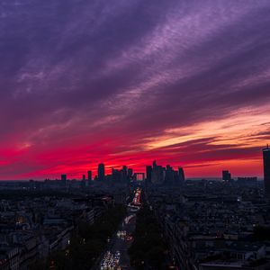 Preview wallpaper city, buildings, road, lights, sunset, evening