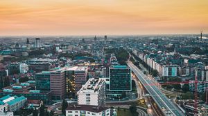 Preview wallpaper city, buildings, road, architecture, dusk
