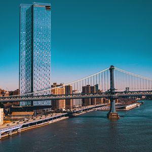 Preview wallpaper city, buildings, road, bridge, river, pier