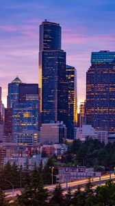 Preview wallpaper city, buildings, road, lights, twilight