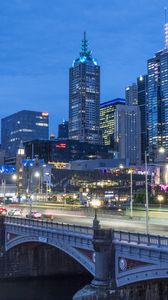 Preview wallpaper city, buildings, road, bridge, lights, twilight