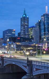 Preview wallpaper city, buildings, road, bridge, lights, twilight