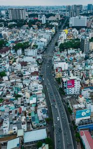 Preview wallpaper city, buildings, road, cityscape, aerial view, metropolis