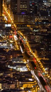 Preview wallpaper city, buildings, road, backlight, aerial view
