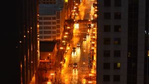 Preview wallpaper city, buildings, road, cars, lights, aerial view, dark