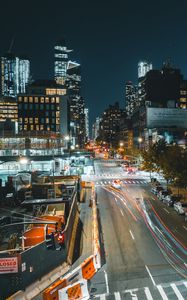 Preview wallpaper city, buildings, road, night, lights, aerial view