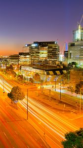 Preview wallpaper city, buildings, road, twilight, lights, aerial view