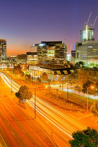 Preview wallpaper city, buildings, road, twilight, lights, aerial view