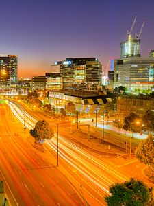 Preview wallpaper city, buildings, road, twilight, lights, aerial view