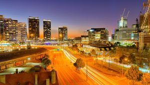 Preview wallpaper city, buildings, road, twilight, lights, aerial view