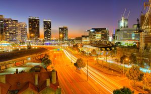 Preview wallpaper city, buildings, road, twilight, lights, aerial view