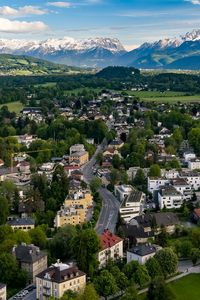 Preview wallpaper city, buildings, road, mountains, aerial view