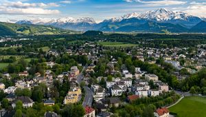 Preview wallpaper city, buildings, road, mountains, aerial view