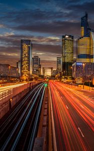 Preview wallpaper city, buildings, road, light, long exposure, twilight