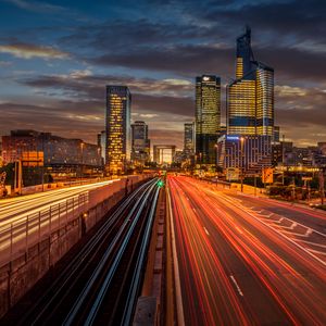 Preview wallpaper city, buildings, road, light, long exposure, twilight