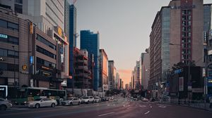 Preview wallpaper city, buildings, road, street, sunset