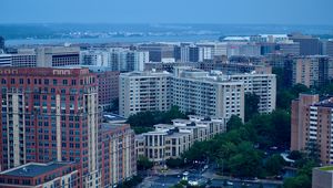 Preview wallpaper city, buildings, road, aerial view, twilight