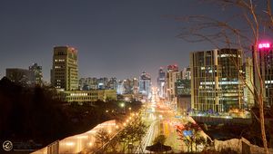 Preview wallpaper city, buildings, road, lights, twilight, aerial view