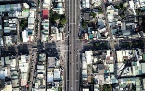 Preview wallpaper city, buildings, roofs, road, aerial view