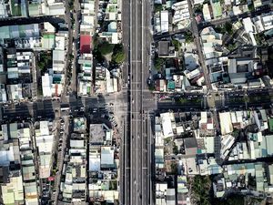 Preview wallpaper city, buildings, roofs, road, aerial view