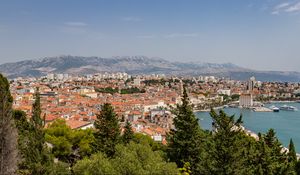 Preview wallpaper city, buildings, roofs, aerial view, architecture, trees