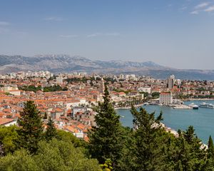 Preview wallpaper city, buildings, roofs, aerial view, architecture, trees