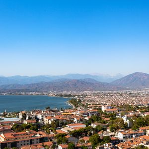 Preview wallpaper city, buildings, roofs, architecture, mountains, aerial view