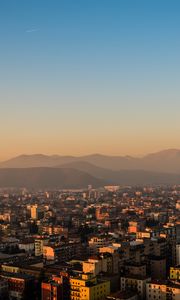 Preview wallpaper city, buildings, roofs, mountains, aerial view