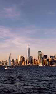 Preview wallpaper city, buildings, sailboat, water