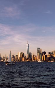 Preview wallpaper city, buildings, sailboat, water