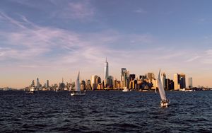 Preview wallpaper city, buildings, sailboat, water